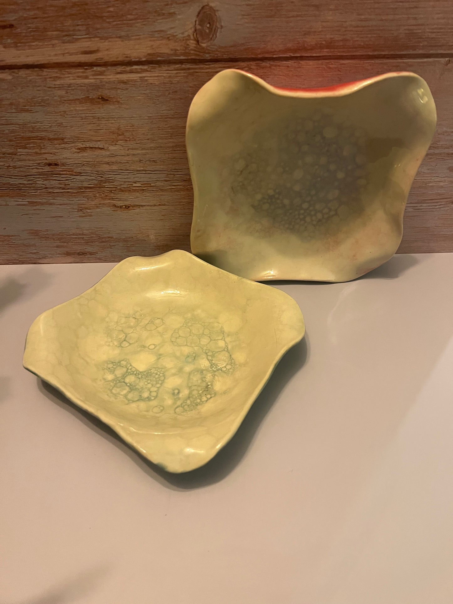 Bowl - altered rim with bubble glaze. Raspberry